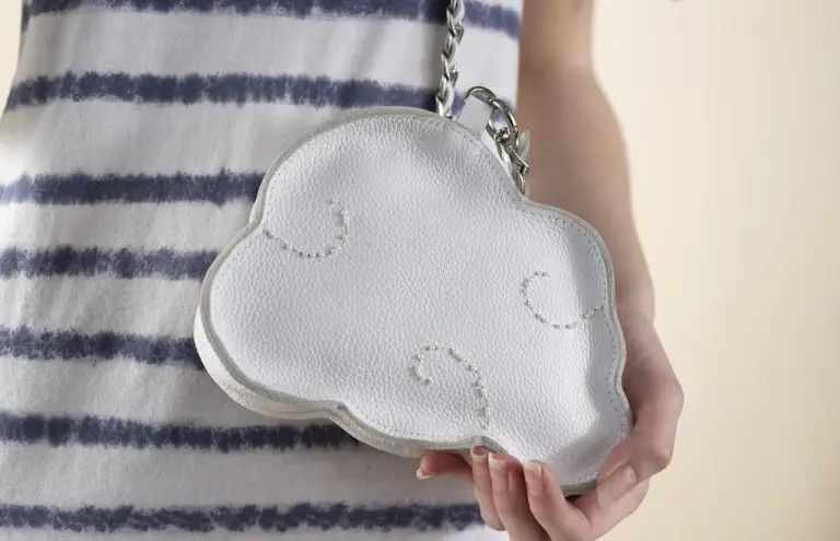 Close-up of black leather cloud-shaped couture bag embroidered with beads and sequins, designed by Saskia ter Welle