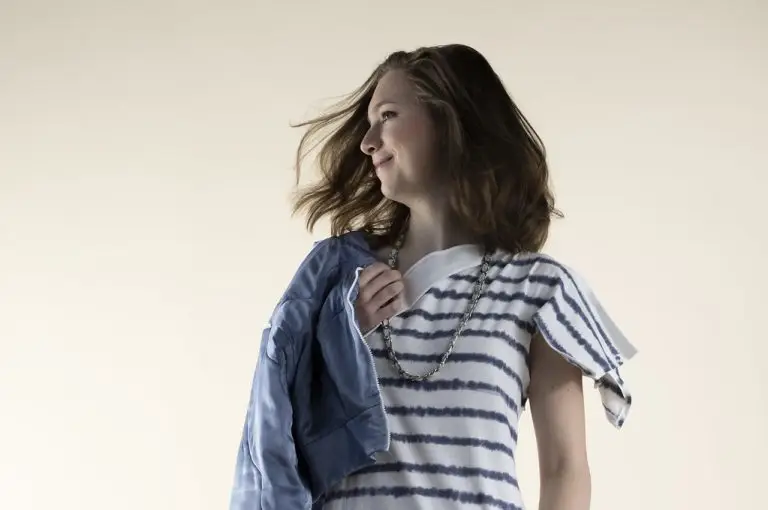 Asymmetrical jersey dress with hand-dyed cloudy Breton stripe, paired with beaded cloud-shaped bag and quilted bomber jacket in hand-dyed viscose with cloud motifs, couture by Saskia ter Welle in dialogue with Manuela Luchtmeijer’s cloud paintings