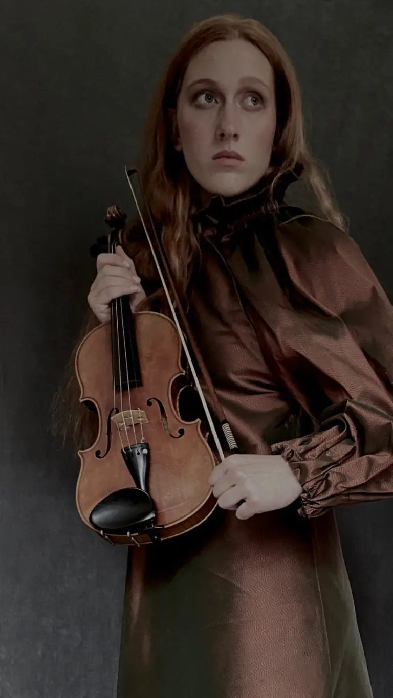 Brown Thai silk couture dress with asymmetrical bias-cut silhouette, designed by Saskia ter Welle as a stage outfit for musicians