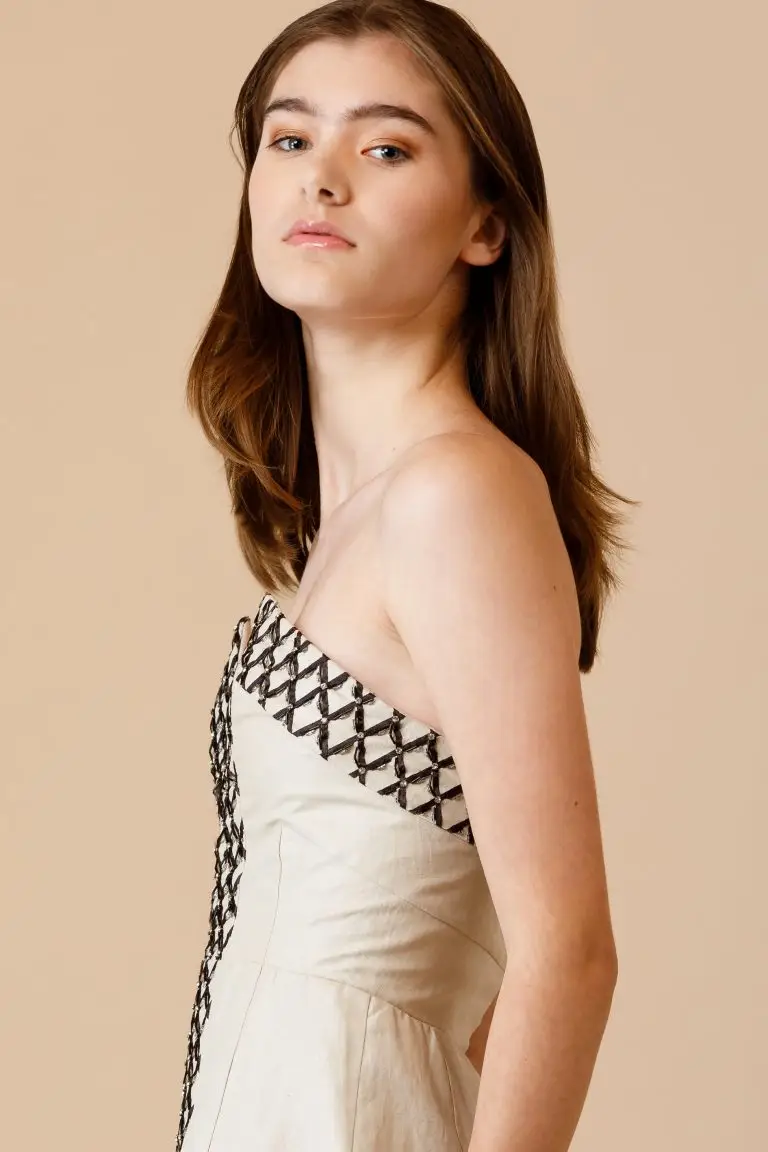 Strapless sand-coloured linen cocktail dress with black and silver embroidery in ribbon, beads and Swarovski crystals, created with Japanese pattern technique, couture by Saskia ter Well