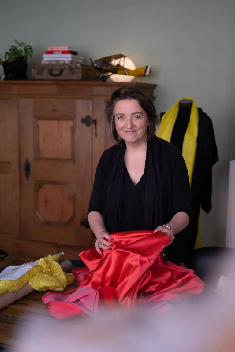 Saskia ter Welle selecting fabrics for a couture creation in her atelier