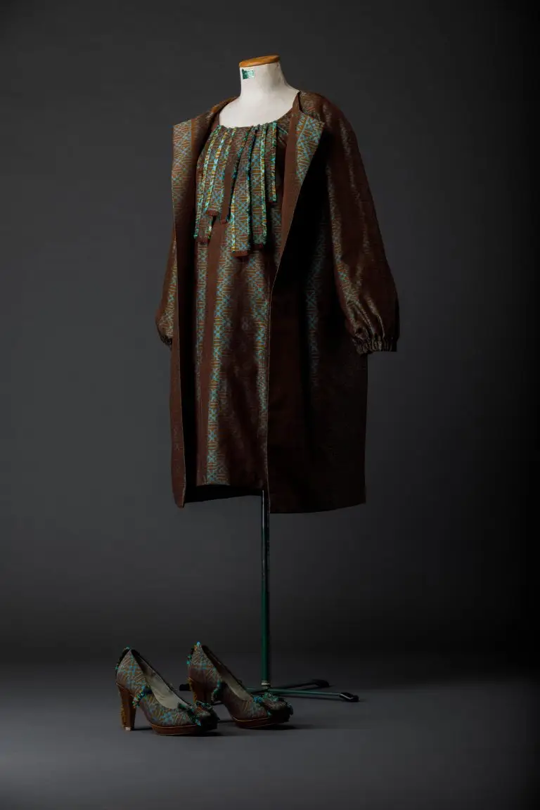 Brown and green couture ensemble with silk dress, matching coat and silk-covered pumps, designed for the ambassador’s wife by Saskia ter Welle