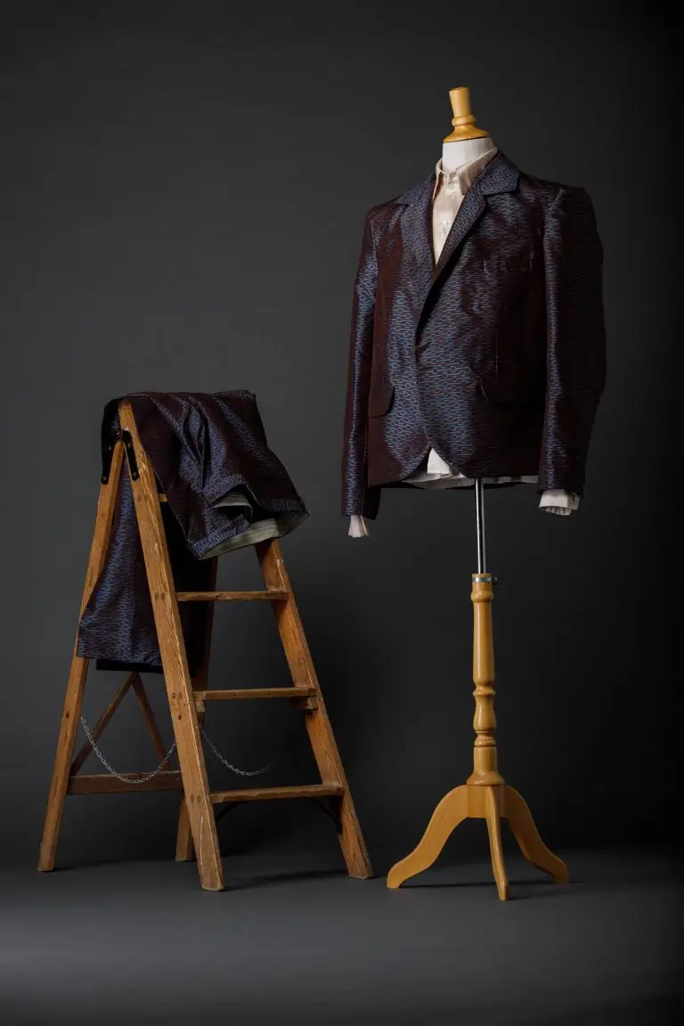 Studio photo of couture suit in Thai silk with woven graphic pattern, paired with matching shirt, by Saskia ter Welle