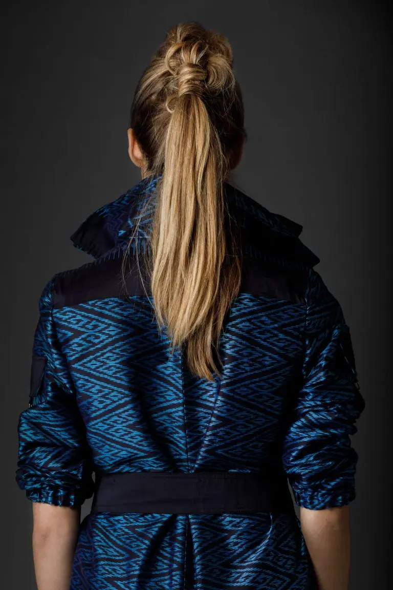 Back view of couture look in silk with graphic print, featuring workwear-inspired details reimagined in refined fabric, by Saskia ter Welle