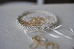 Atmospheric photo of couture atelier: dish with beads and ribbon used for hand embroidery by Saskia ter Welle